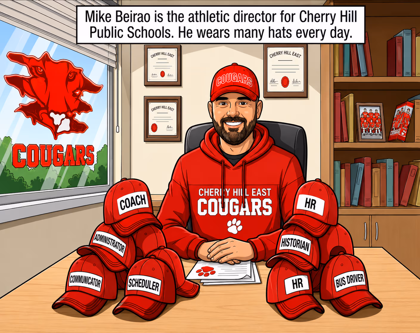 Mike Beirao, athletic director for Cherry Hill Public Schools, sitting at his desk surrounded by hats representing his many roles.