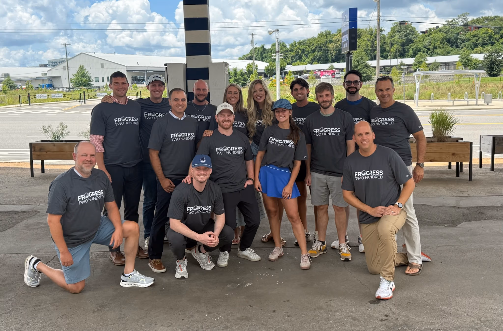The Ballfrog team in Nashville, wearing Frogress Two Hundred shirts.