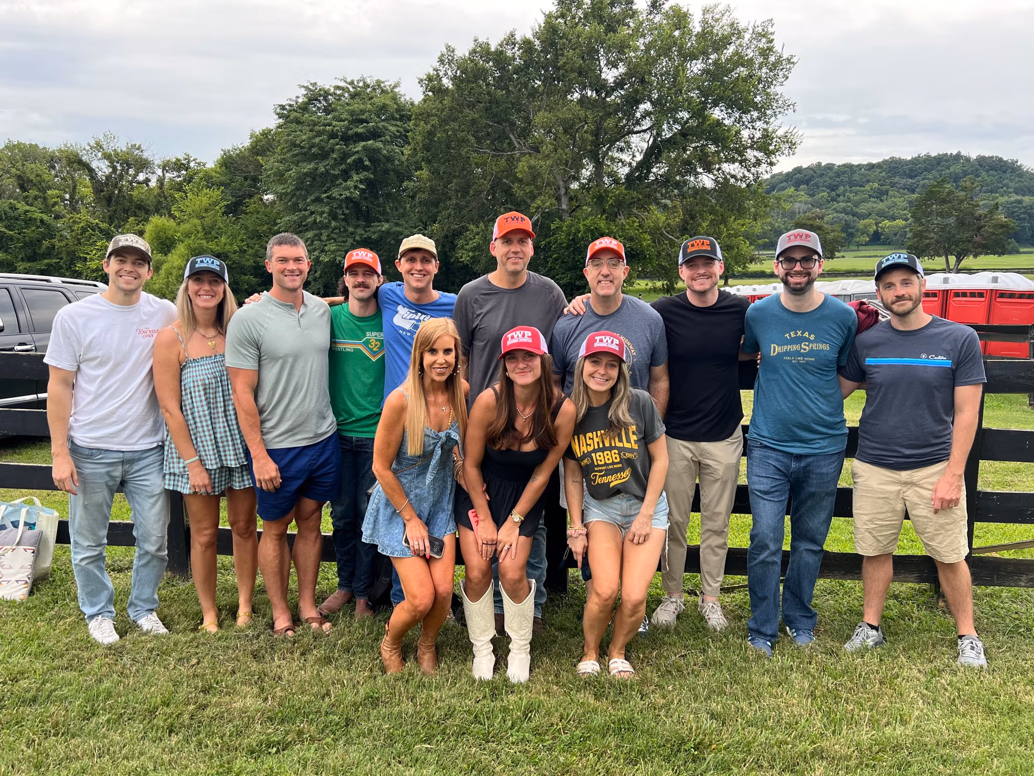 The Ballfrog team gathered in front of a fence at an outdoor event in Tennessee.